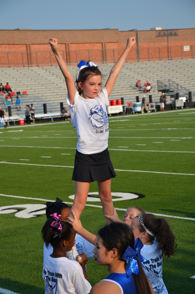 8-29-15 aiden and annslee cheer at varsity game 010